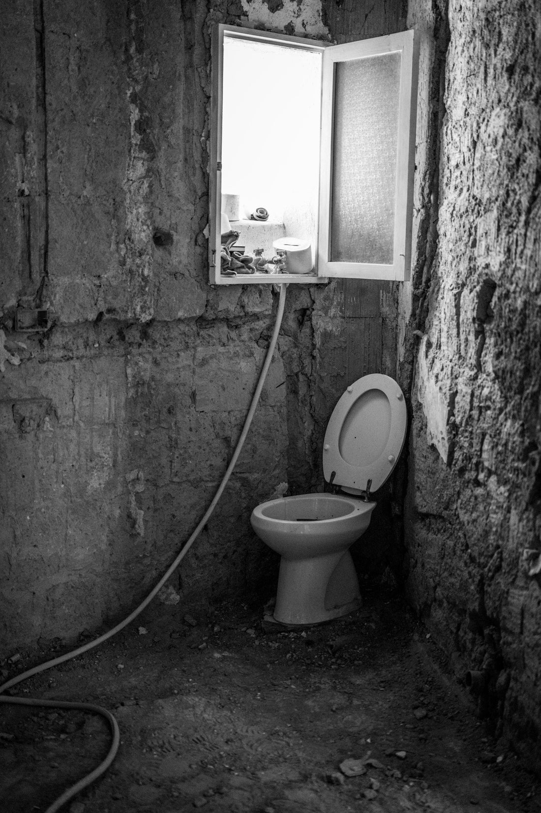 Real toilet being inspected during bathroom renovation